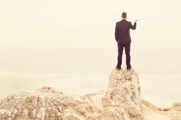 istock Businessman on top of Mountain 874867932