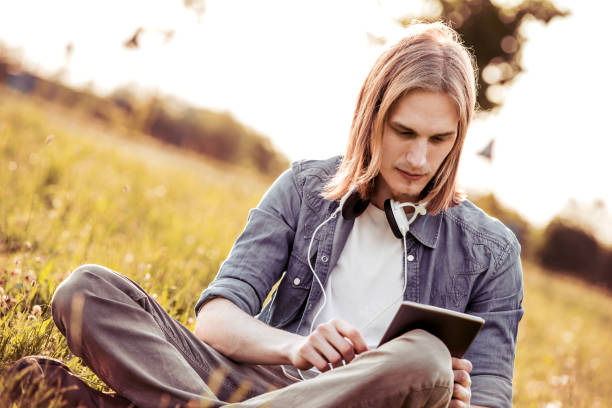 istock Young man having fun in the park 874868814