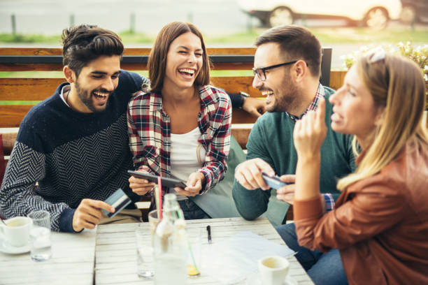 istock Group of four friends having fun a coffee together 874871034