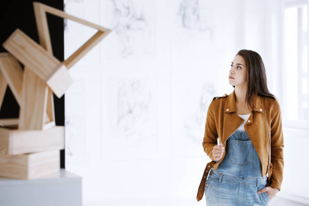 Student of art Student of art sightseeing a museum featuring a new exhibition of sculptures and paintings gallery opening stock pictures, royalty-free photos & images