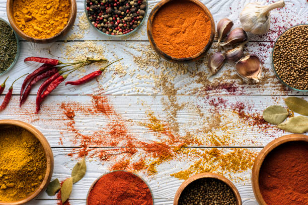 istock scattered spices and glasses with spices 874875164