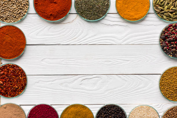 istock spices in glass bowls on white table 874875212