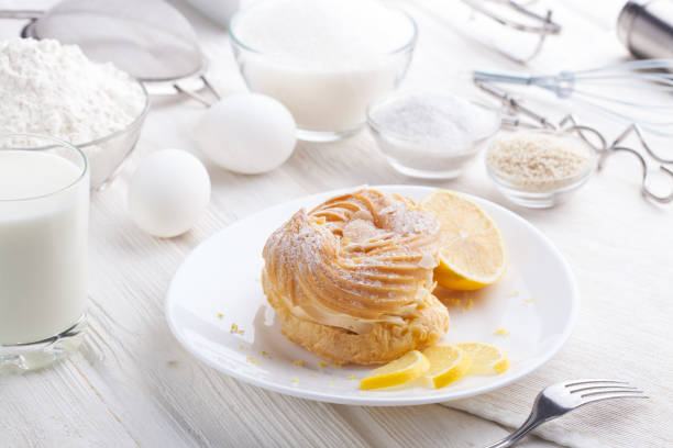 istock Ingredients for baking delicious cakes on a white wooden table 874875286