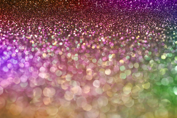 istock colorful pastel purple pink green bokeh light glitter background for Christmas 874875310