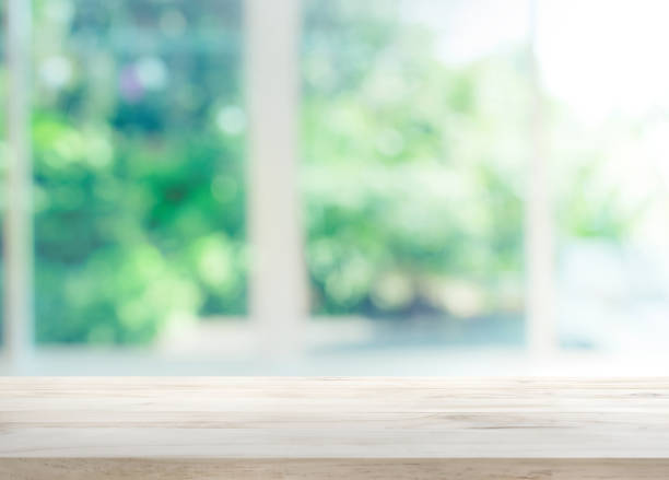 Wood table top on blur of window with garden flower Wood table top on blur of window with garden flower background in morning.For montage product display or design key visual layout kitchen counter photos stock pictures, royalty-free photos & images
