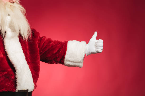 istock cut out side view of santa claus making ok 874875802