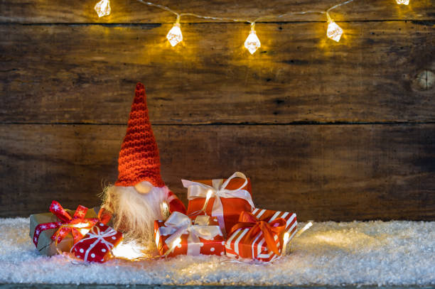 istock Christmas presents with lights and Santa Claus 874879420