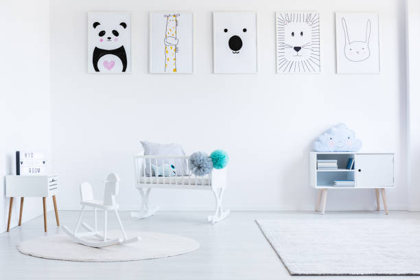 istock White rocking horse on carpet 874880286