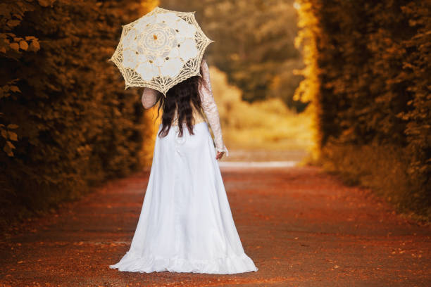 Mysterious woman in Victorian dress with back