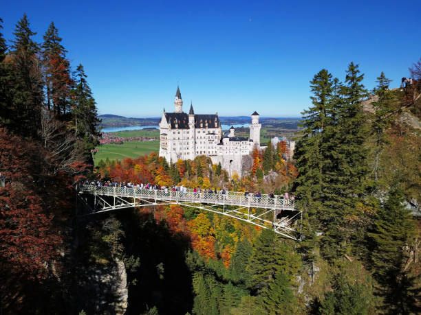 Neuschwanstein Castle is a beautiful palace built on a rugged hill by Ludwig II of Bavaria in the 19th-century. It is located on the famous Romantic Road (Romantische Straße), a \