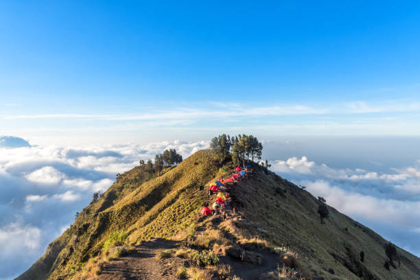 Camping site on crater rim of Mount Rinjani at sunset. Lombok Island, Indonesia. Camping site on crater rim of Mount Rinjani at sunset. Lombok Island, Indonesia. lombok indonesia stock pictures, royalty-free photos & images