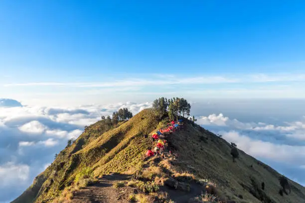 Photo of Camping site on crater rim of Mount Rinjani at sunset. Lombok Island, Indonesia.