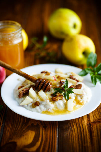 istock sweet milk oatmeal with apples, nuts and honey 874887970
