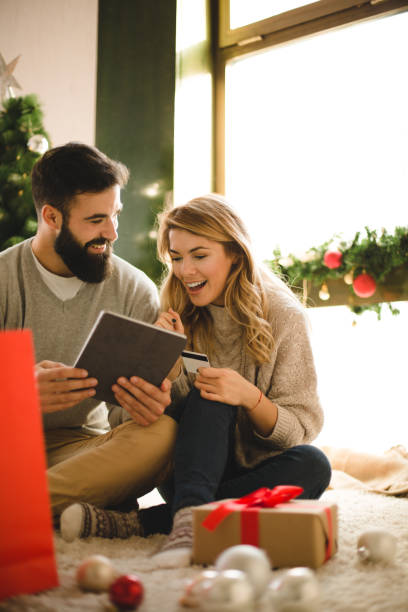 istock Beautiful couple shopping online 874888644