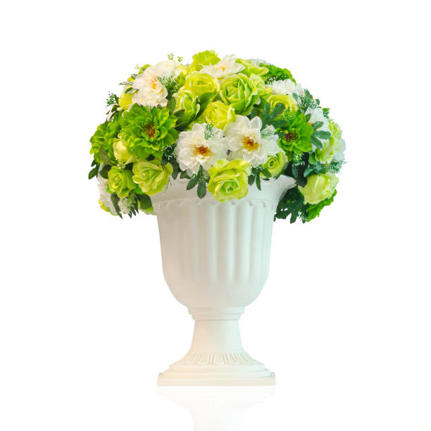 istock White and green artificial flowers in white vase isolated on white background with working path 874891702