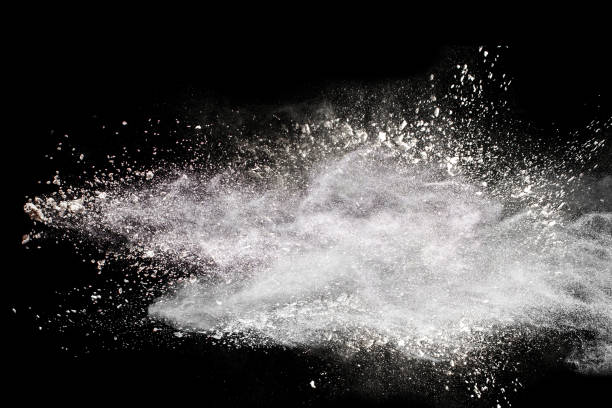 istock Abstract design of white powder explosion cloud against dark background. 874895310