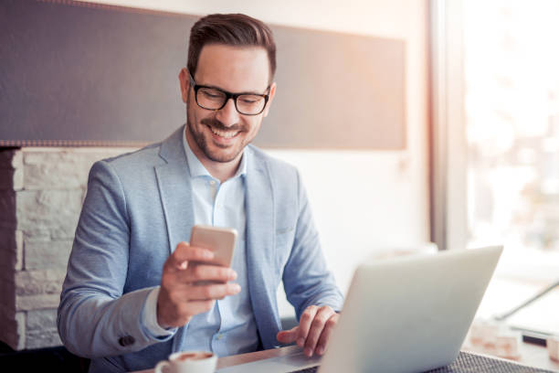 istock Young man working with laptop in office. 874896898