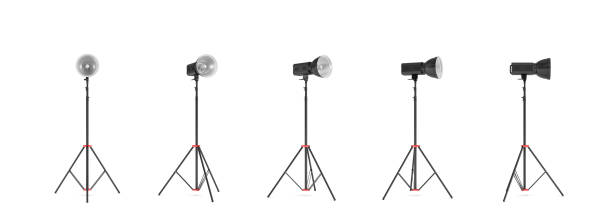 istock 3d rendering of three lights with reflectors with the head turned down and up. 874898882