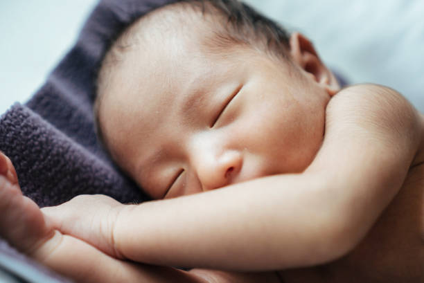 istock Little baby lying on bed at home. 874899978