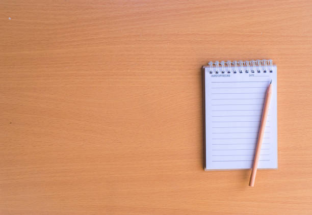 istock Notepad with pencil on wood board background.using wallpaper for education, business photo.Take note of the product for book with paper and concept, object or copy space. 874903336