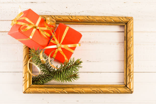 istock Winter presents or gifts concept in an empty picture frame 874903656