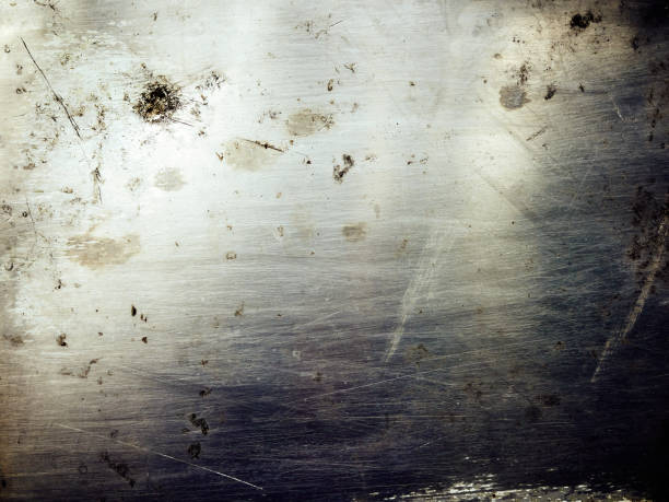 Shiny scratched metal surface close up
