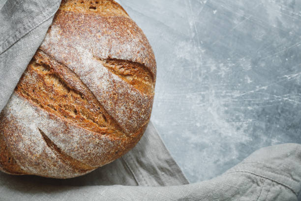 istock Top view of fresh rye bread on a linen towel. Copy space. 874908162