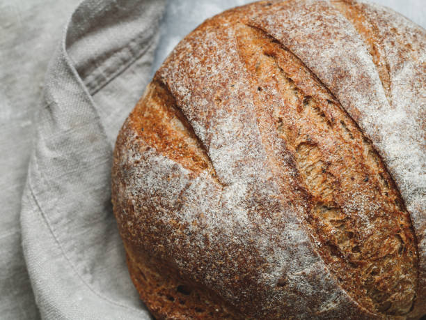 istock Top view of fresh rye bread on a linen towel 874908166