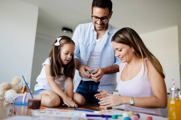 istock Happy familiy spending fun time at home 874910776