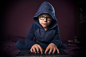Little hacker using laptop