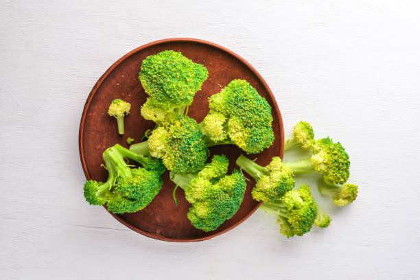 istock Broccoli On a wooden background. Top view. Free space. 874932632