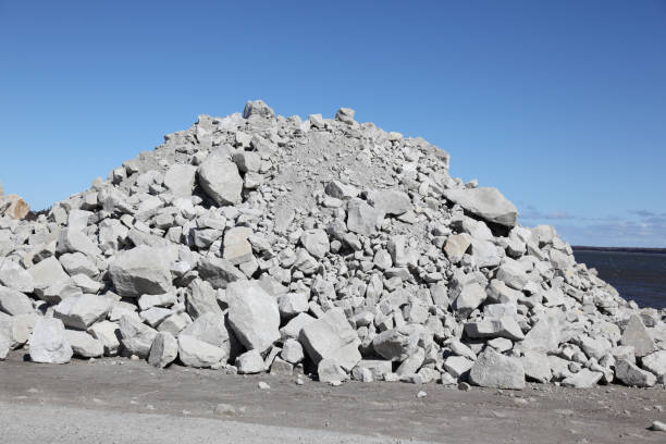 istock Pile of rocks and boulders that will be used for constructing a wharf 874932690