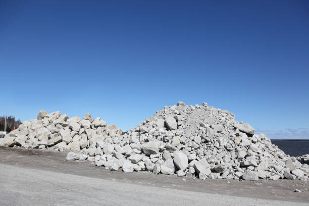istock Pile of rocks and boulders that will be used for constructing a wharf 874932696