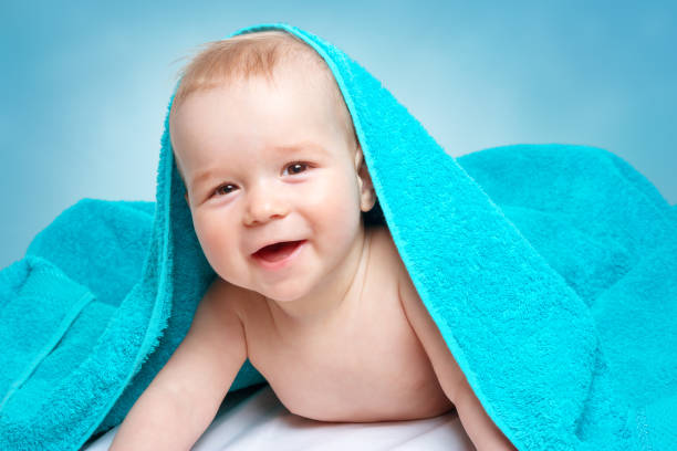 istock Cute baby in a towel 874938018