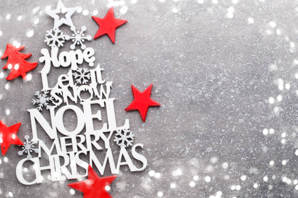istock Christmas wooden decor on the snow background. 874940952