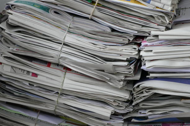 istock Waste cardboard and paper bundle for recycling. Stack of papers. Close up. 874944084