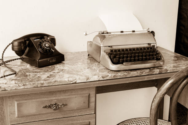 istock Still Life Artwork with Antique Typewriter and Telephone in Sepia 874945398