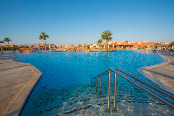 istock Large swimming pool in a luxury tropical hotel resort 874948262