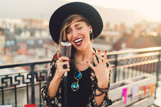 Girl singing on rooftop party