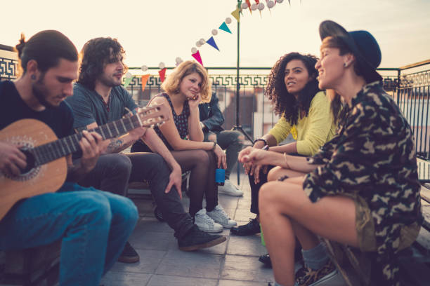 istock Friends on rooftop party 874951350