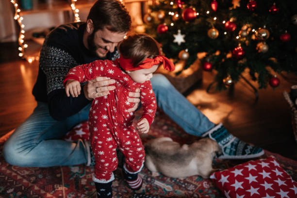 istock Dad and his daughter playing with little puppy 874959032
