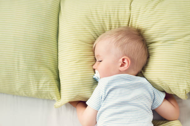 istock One year old baby in the bed 874961860