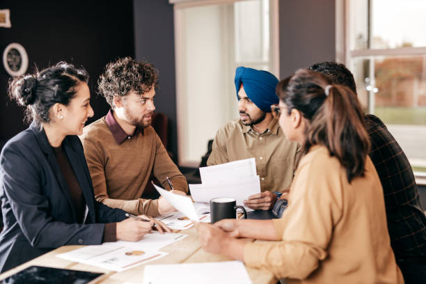 istock People working late in the office 874962446