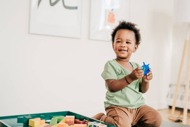 istock Toddler playing with toy 874962708