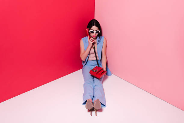 istock stylish girl with retro phone 874966230