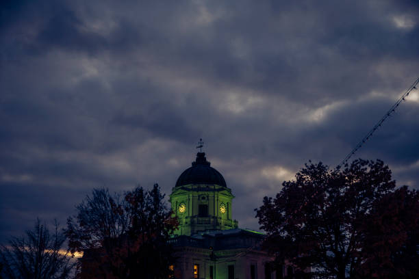 istock Monroe County Courthouse lighted with green light at dusk in Bloomington, Indiana 874968242