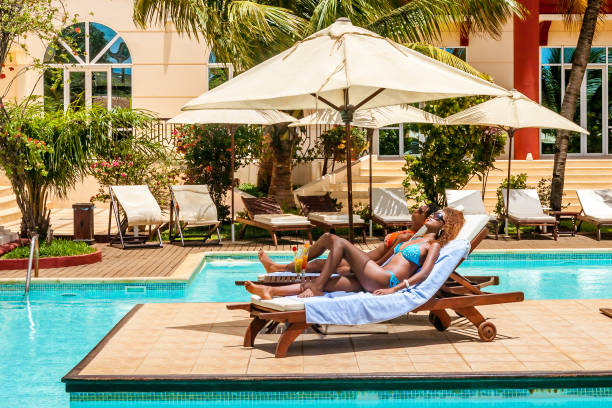 istock Two girls sunbathing 874968660