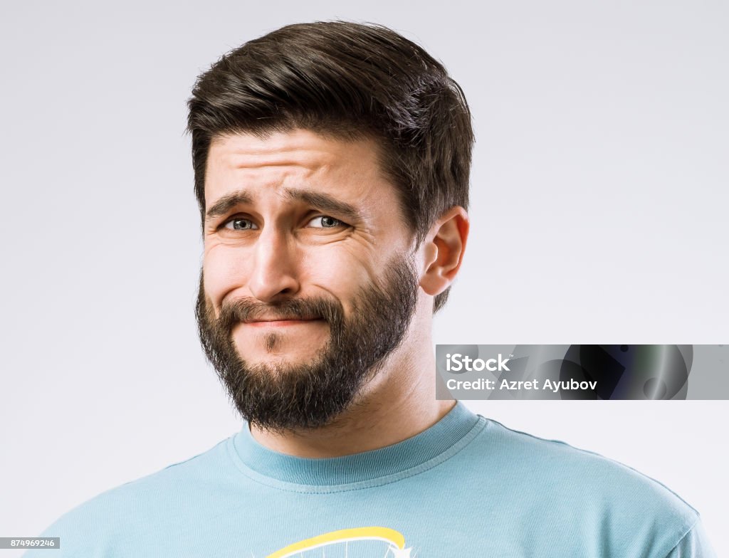 Facial expressions Portrait of bearded guy with disgusted expression on face Human Face Stock Photo