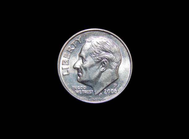 istock American one dime coin (10 cents) isolated on black background 874970104