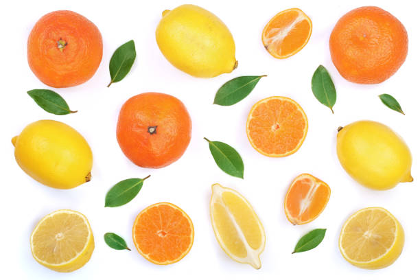 istock lemon and tangerine with leaves isolated on white background. Flat lay, top view. Fruit composition 874976044